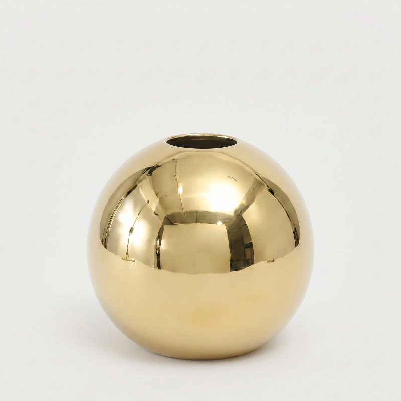 Round gold vase on white background