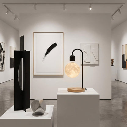 Selene floating moon lamp with wireless charging in modern gallery-style interior