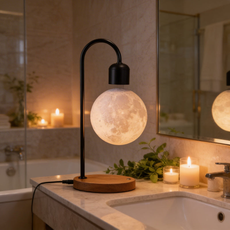Moon-shaped lamp on a bathroom counter with candles and plants