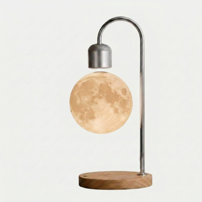 Selene floating moon lamp with wireless charging on light wood base on white background