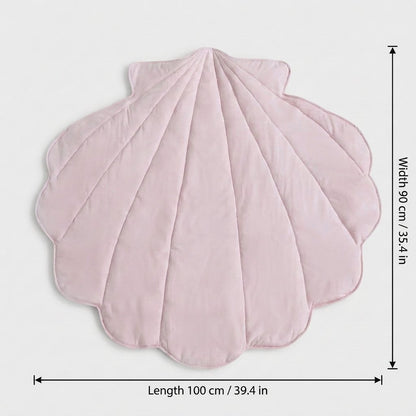 A pink quilted shell-shaped blanket or rug shown on a light gray background with dimension lines indicating a length of 100 cm (39.4 in) and a width of 90 cm (35.