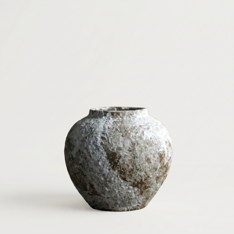 Ceramic rustic circular vase on white background