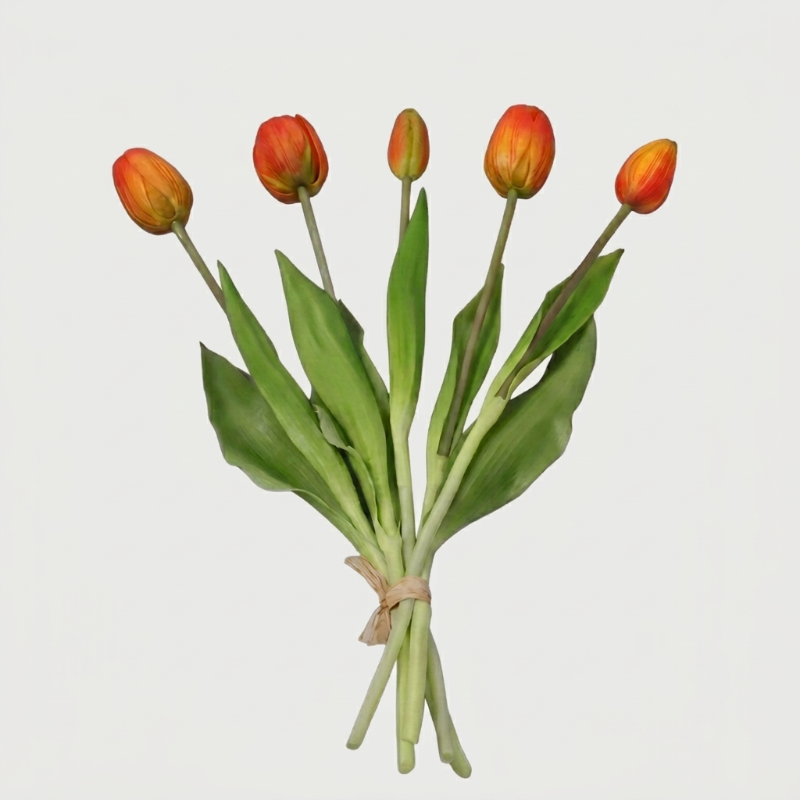 Faux silicone tulip stems in orange and yellow on white background