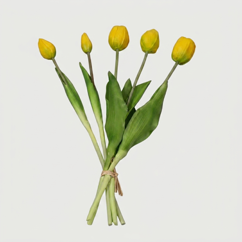 Faux silicone tulip stems in yellow on white background