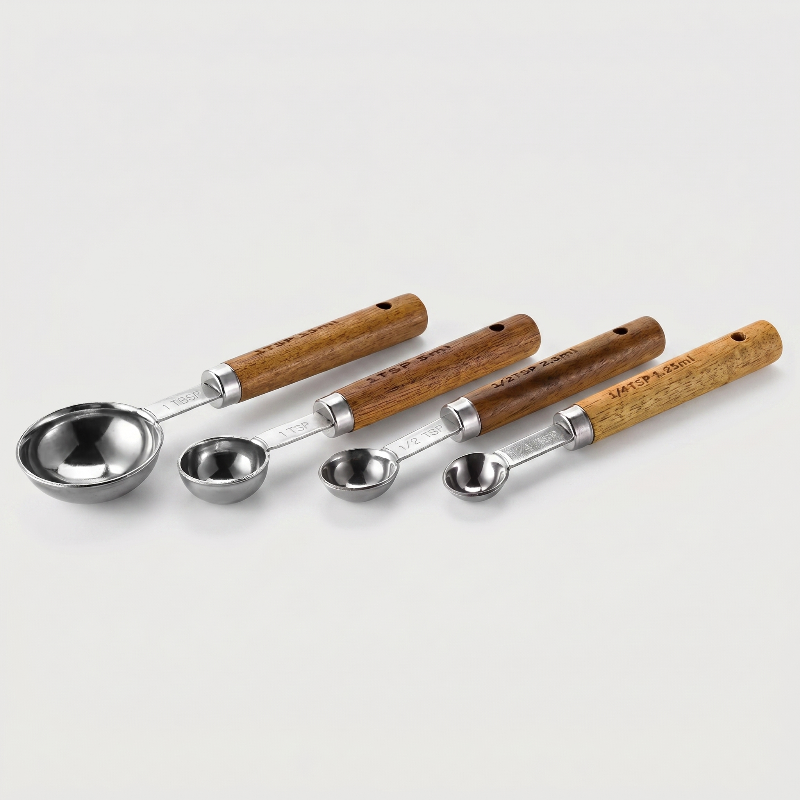 Silver stainless steel measuring spoons set of 4 on white background