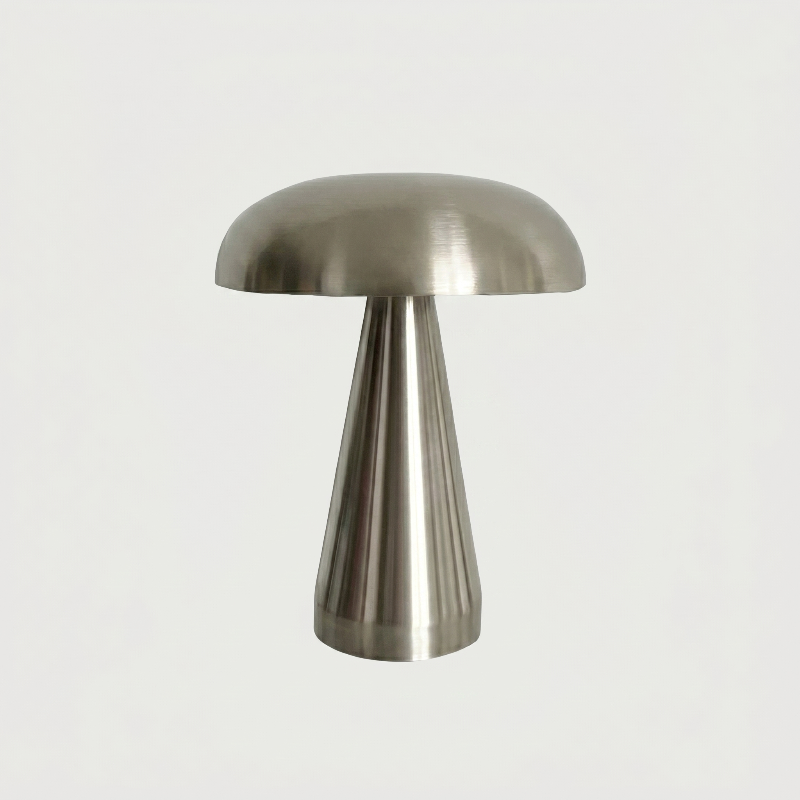 Silver metallic mushroom table lamp on white background