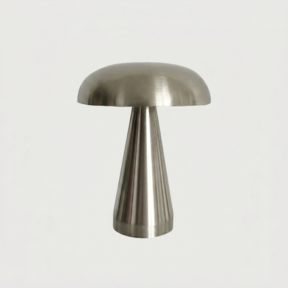 Silver metallic mushroom table lamp on white background