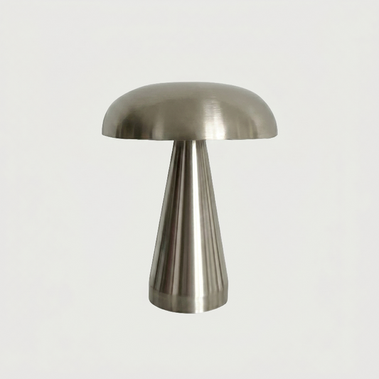 Silver metallic mushroom table lamp on white background