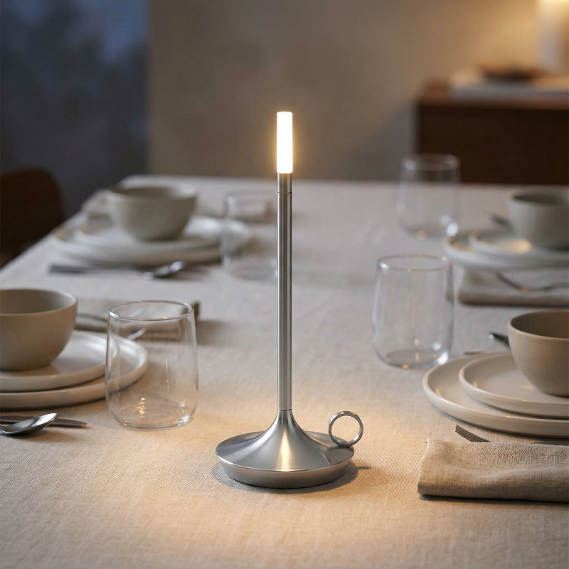 Modern candle holder on a dining table with set place settings