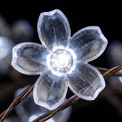 Macro close-up of a single flower-shaped solar string light, Kiyo Home