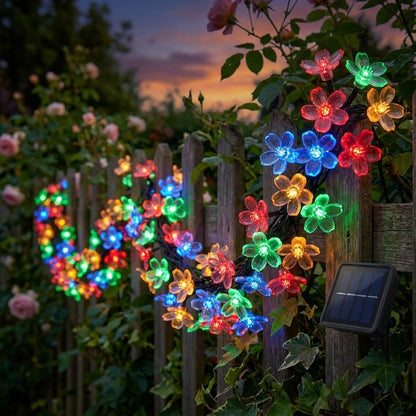 Multicolor solar blossom string lights on a garden fence, Kiyo Home