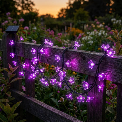 Purple solar blossom string lights on a garden deck railing, Kiyo Home