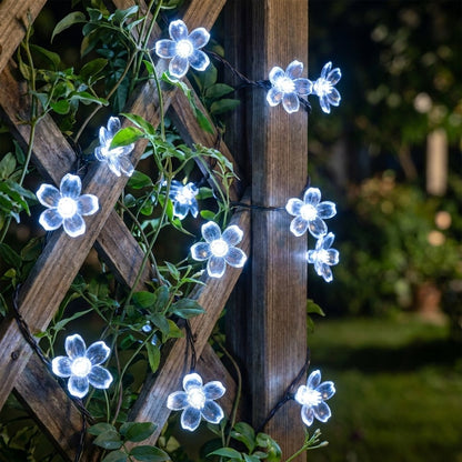 White solar blossom string lights on a garden trellis, Kiyo Home