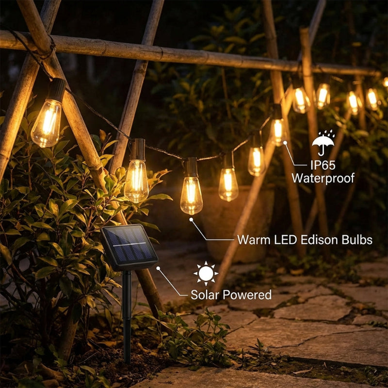 String of warm LED Edison bulbs on a solar-powered system with waterproof rating, hanging outdoors.