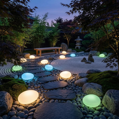 Solar light stones illuminating garden pathway at night