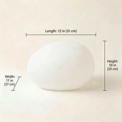 White spherical object with measurements on a beige background
