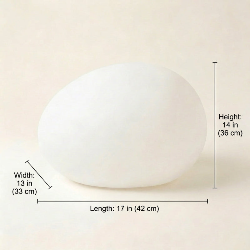 White spherical object with dimensions labeled on a beige background