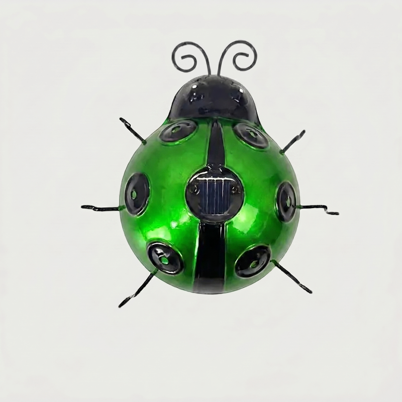 Green solar metal ladybug garden light on white background