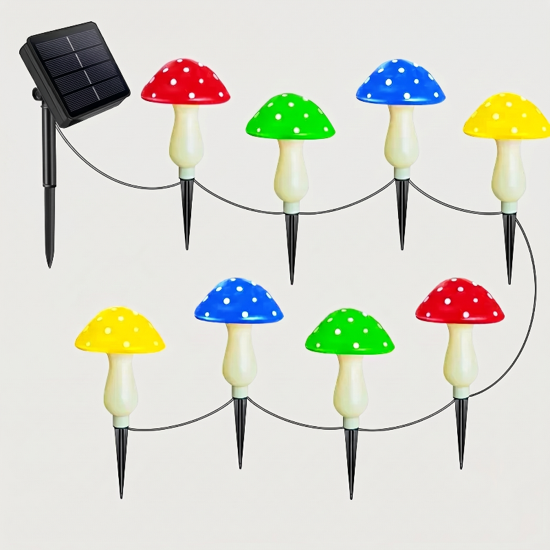 Solar mushroom accent lights with solar panel and red, green, blue, and yellow caps on white background