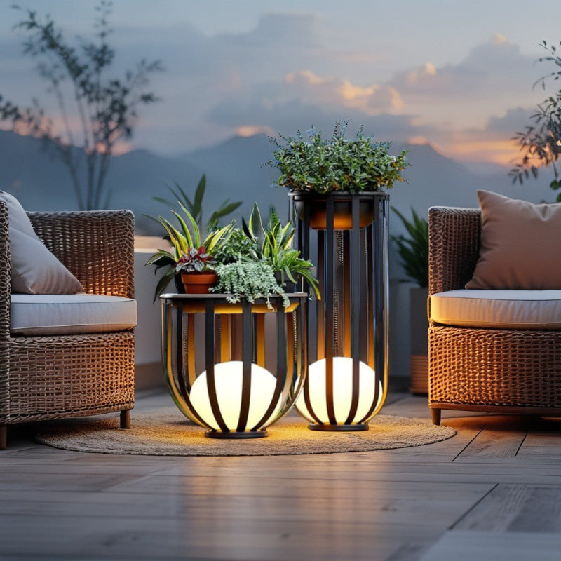Solar planter tables with integrated light beside patio seating at dusk