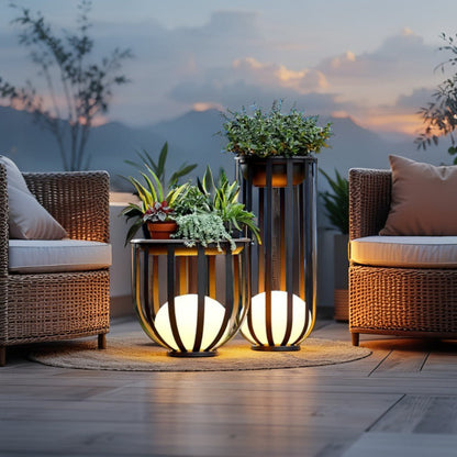 Solar planter tables with integrated light beside patio seating at dusk
