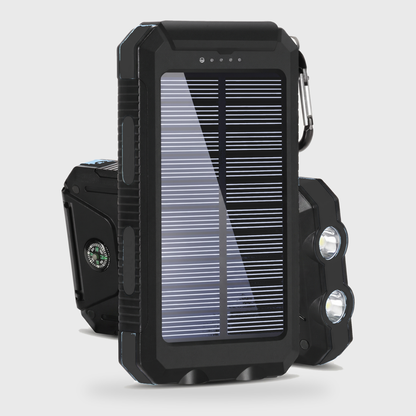 Black solar powered portable charger power bank with a solar panel, dual LED lights, and compass on a clean off-white background