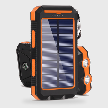 Orange solar powered portable charger power bank with a solar panel, dual LED lights, and compass on a clean off-white background