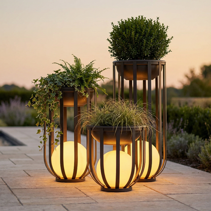 Decorative outdoor lanterns with plants and lights on a patio