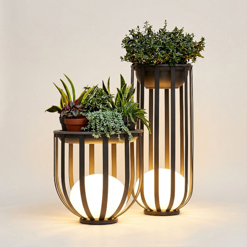 Decorative outdoor lamps with plant stands on a neutral background