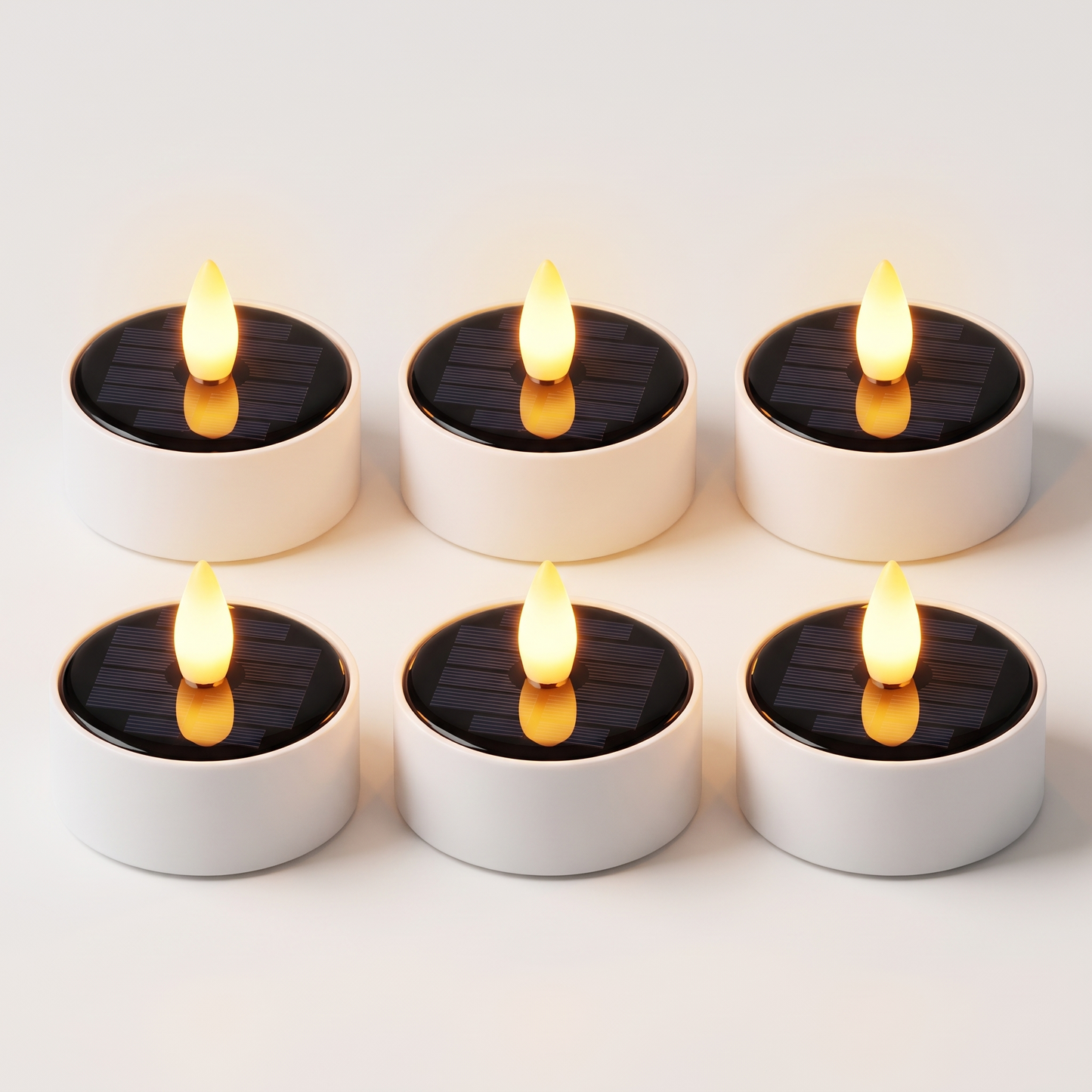 Set of 6 solar LED flameless tea light candles with black solar tops and warm amber flames, Kiyo Home