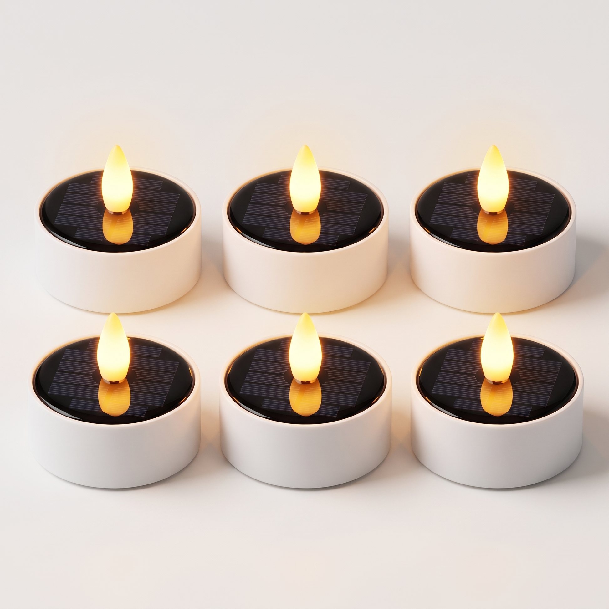 Set of 6 solar LED flameless tea light candles with black solar tops and warm amber flames, Kiyo Home