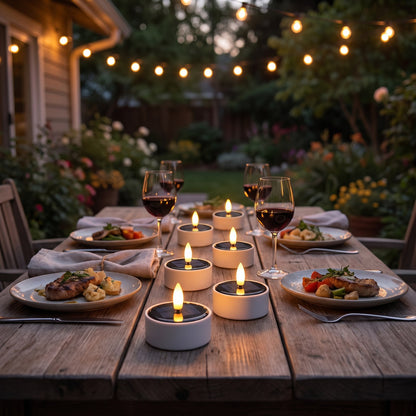 Solar LED flameless tea light candles on an al fresco patio dinner table with string lights, Kiyo Home