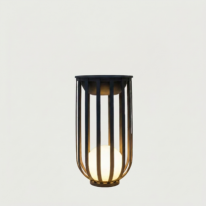 Decorative solar lamp with black metal cage and glass shade on a light gray background