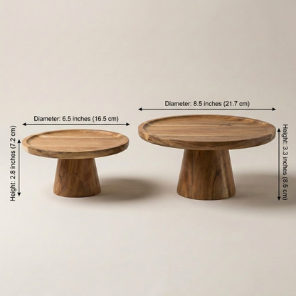 Two wooden cake stands with measurements on a beige background