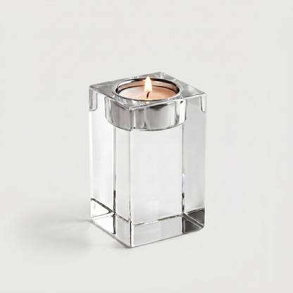 Tall square glass candle holder on white background