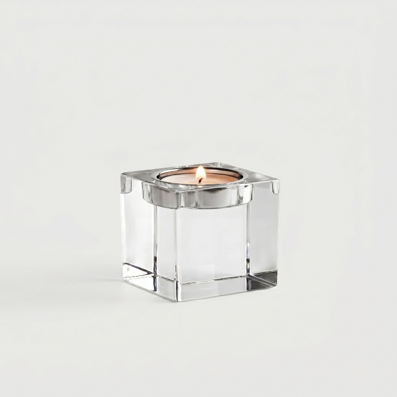 Small square glass candle holder on white background