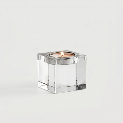 Small square glass candle holder on white background