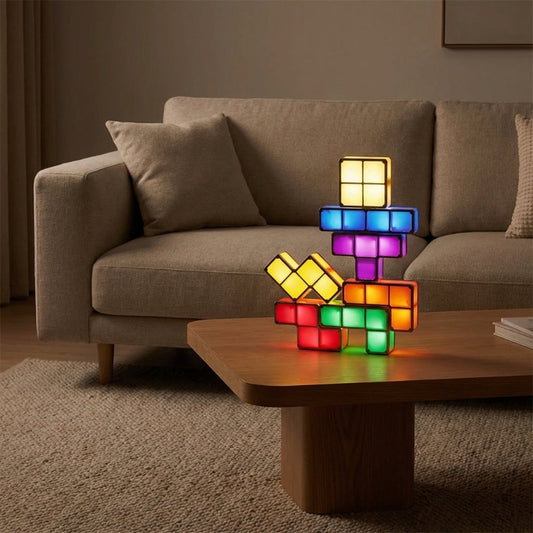 Colorful block-style lamp on a wooden coffee table in a living room setting.