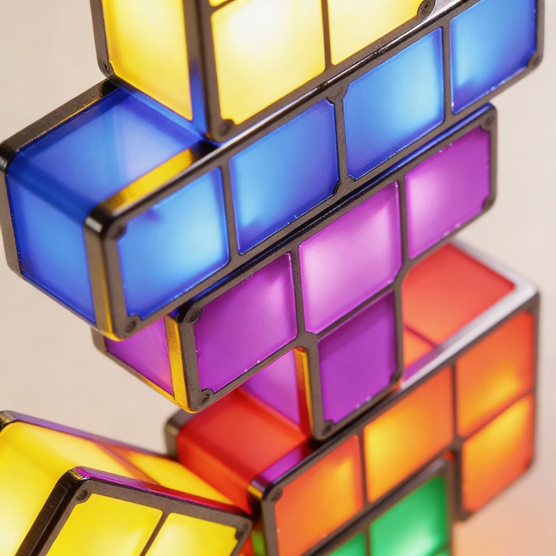 Colorful 3D puzzle with interlocking blocks on a neutral background