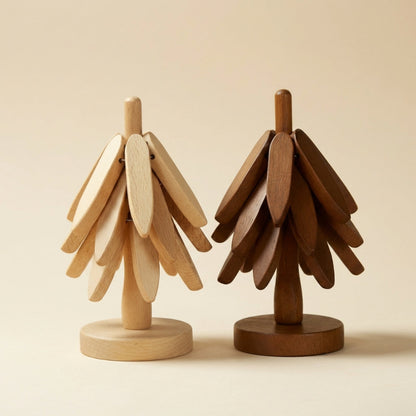 Two wooden tree sculptures, one beige and one brown, on a beige background.