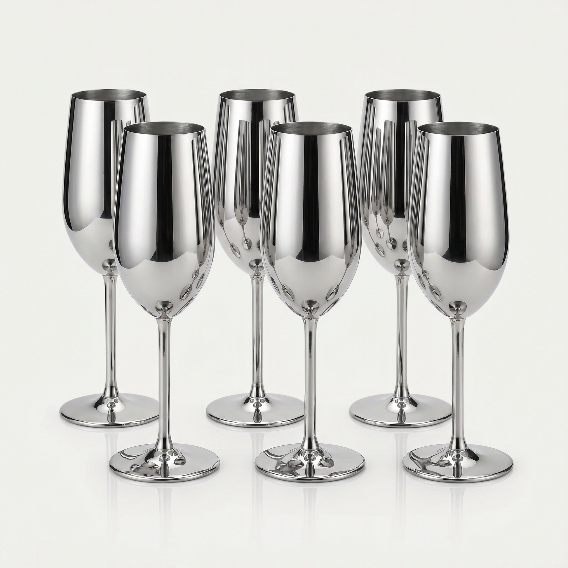 Set of six silver stainless steel stemmed champagne flutes with a mirror-polished finish on a clean off-white background