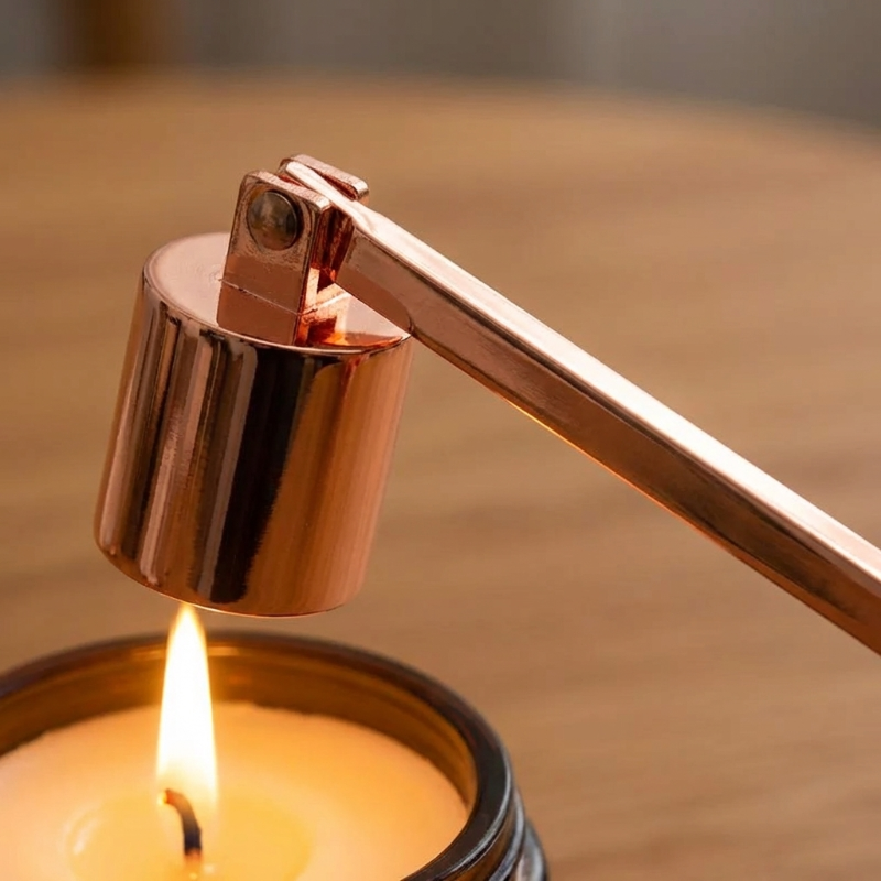 Rose gold stainless steel candle snuffer extinguishing candle flame