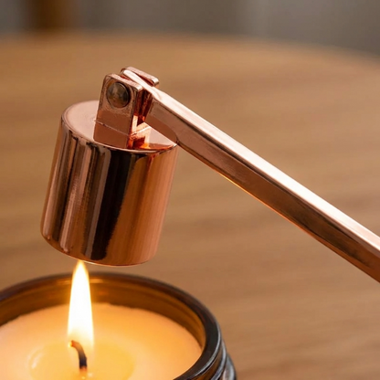 Rose gold stainless steel candle snuffer extinguishing candle flame