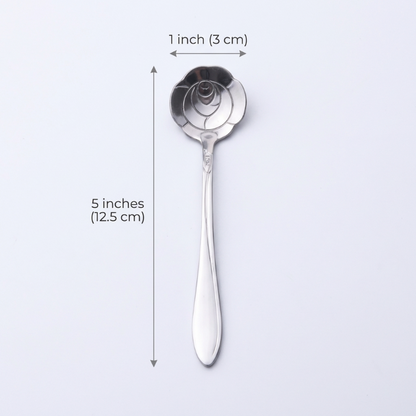 Silver spoon with measurements on a light gray background