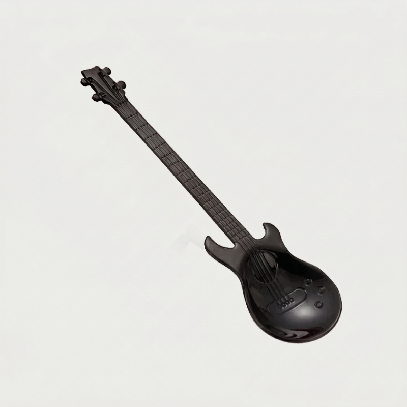 Black stainless steel guitar spoon on white background