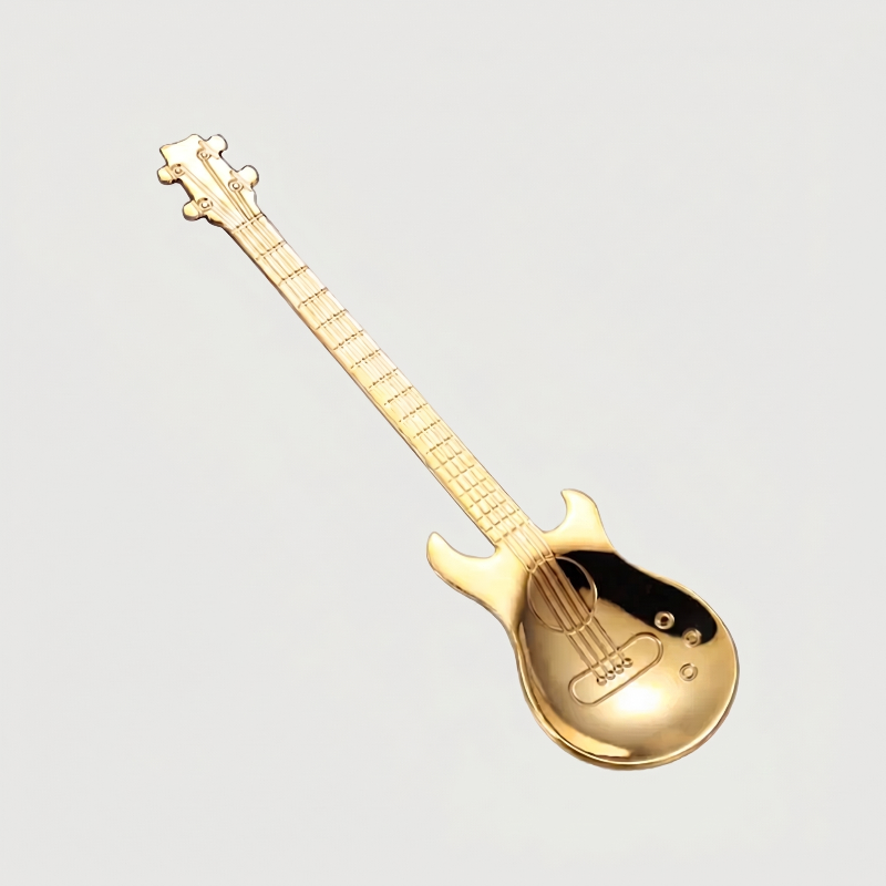 Gold stainless steel guitar spoon on white background