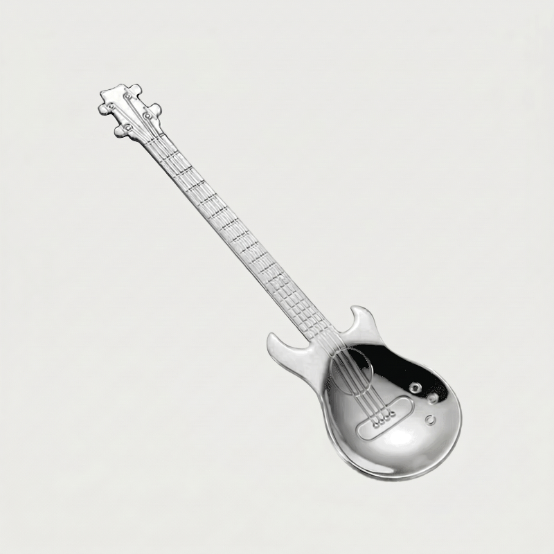 Silver stainless steel guitar spoon on white background