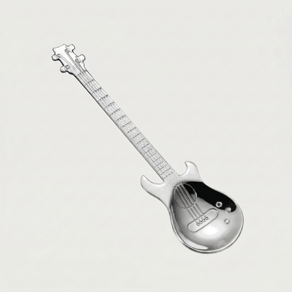 Silver stainless steel guitar spoon on white background
