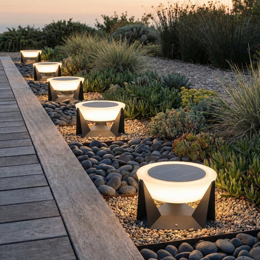 Solar-powered outdoor lights on pebbles near a wooden pathway with plants in the background