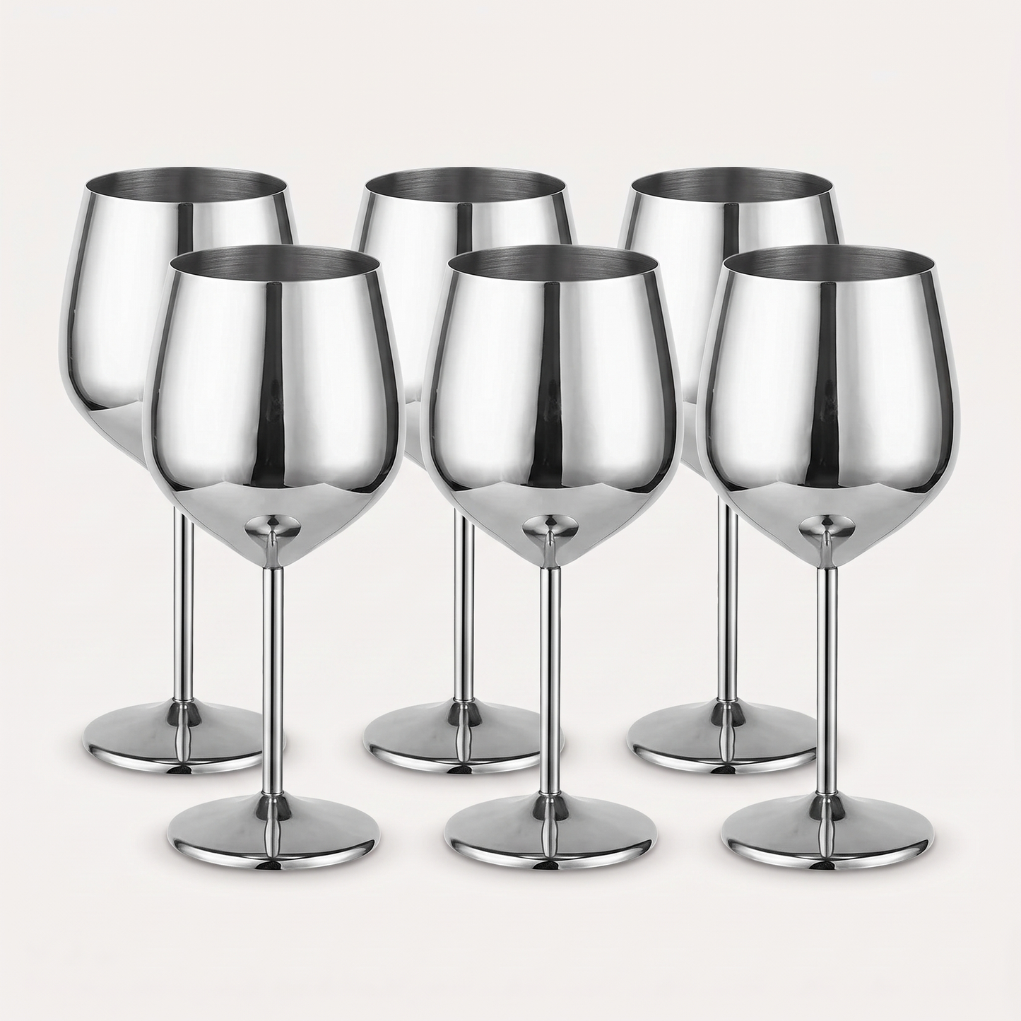 Set of six silver stainless steel stemmed wine glasses with a mirror-polished finish on a clean off-white background